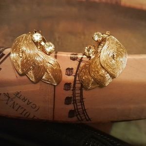 Gold clip on earrings.